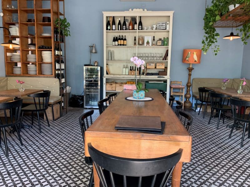 The interiors of Santarosa Bistrot with checked tiled flooring.