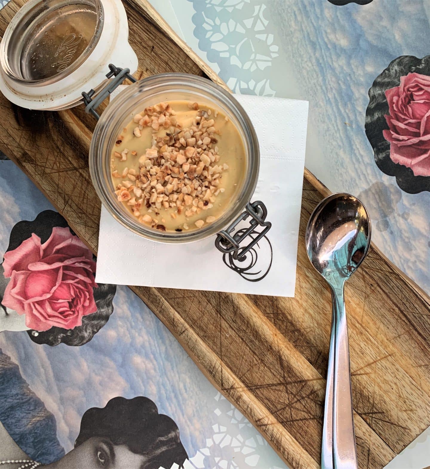 Hazelnut tiramisu in a Kilner jar with a light blue table cover at Santarosa Bistrot