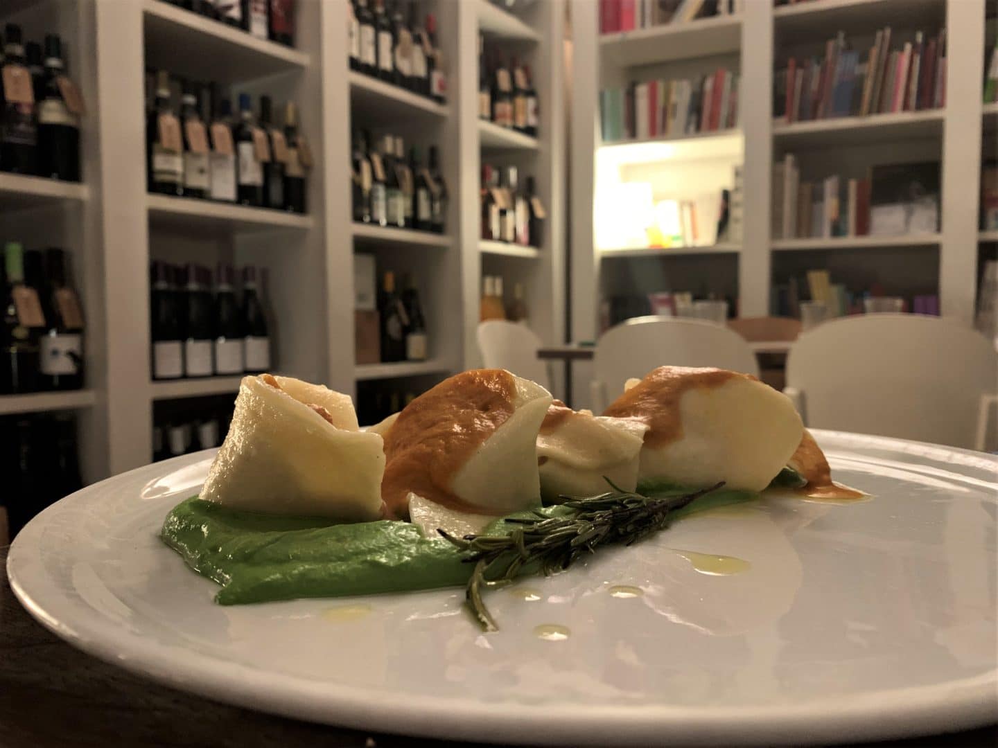 Ravioli covered in pea puree at BRAC
