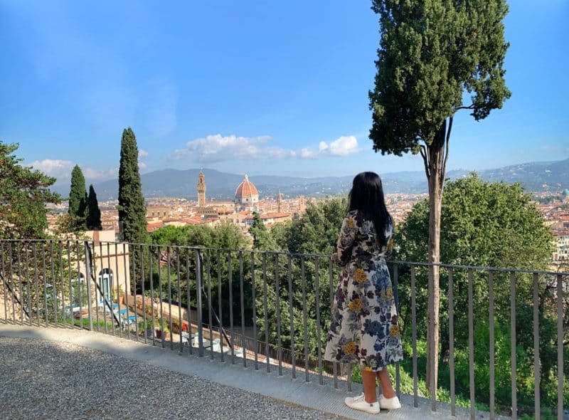  Oltrarno An Artisanal Neighbourhood in Florence: Bejal standing looking out to view of Florence including the Duomo and Campanile.
