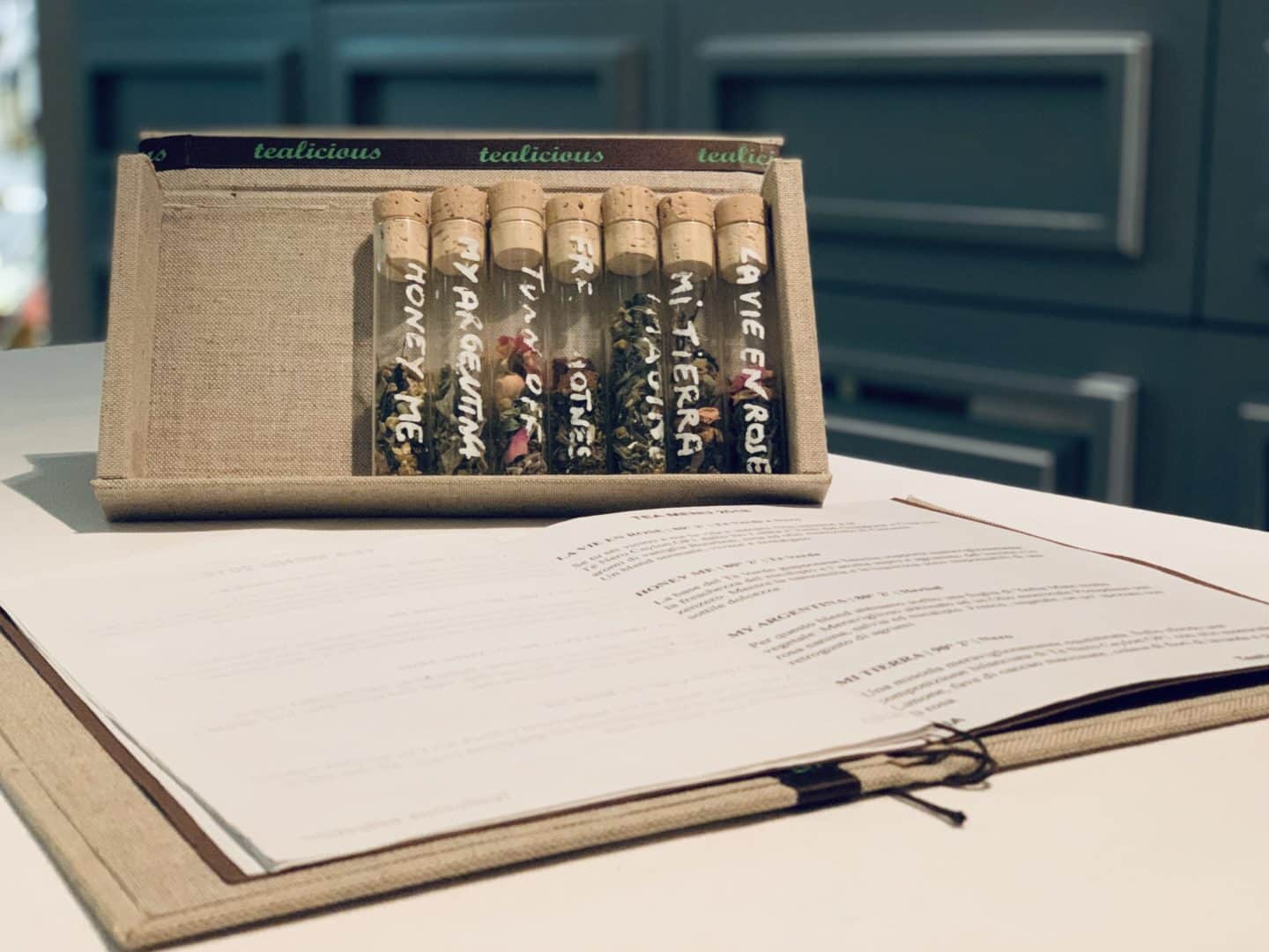 The menu and a test tubes of oil  at Ora D'aria - vegetarian-friendly food in Florence