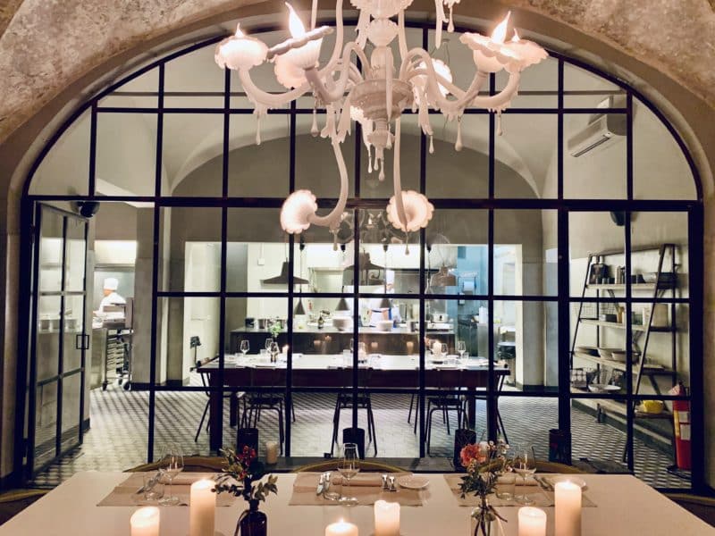 La Ménagère interiors with a archway and a window through to the private dining area.