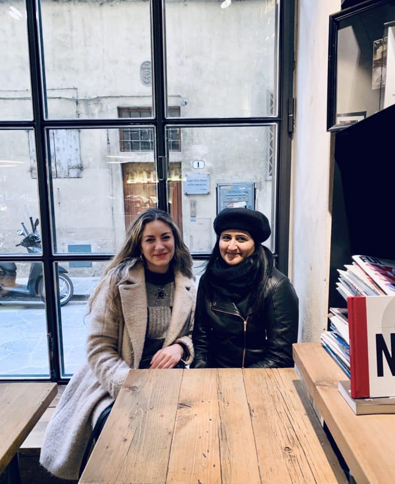 Vegetarian food in Florence - Lucrezia and Bejal sitting at a table at Ditta Artiglianale cafe
