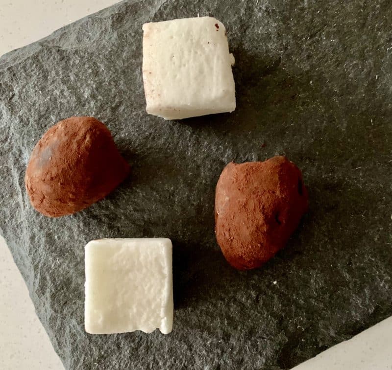 Turkish Delights and cocoa truffles served on a slate with coffee