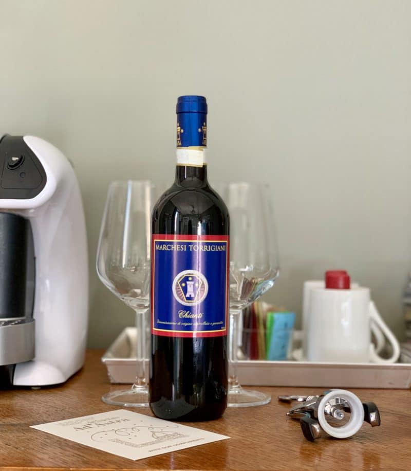 Bottle of wine and glasses in the background