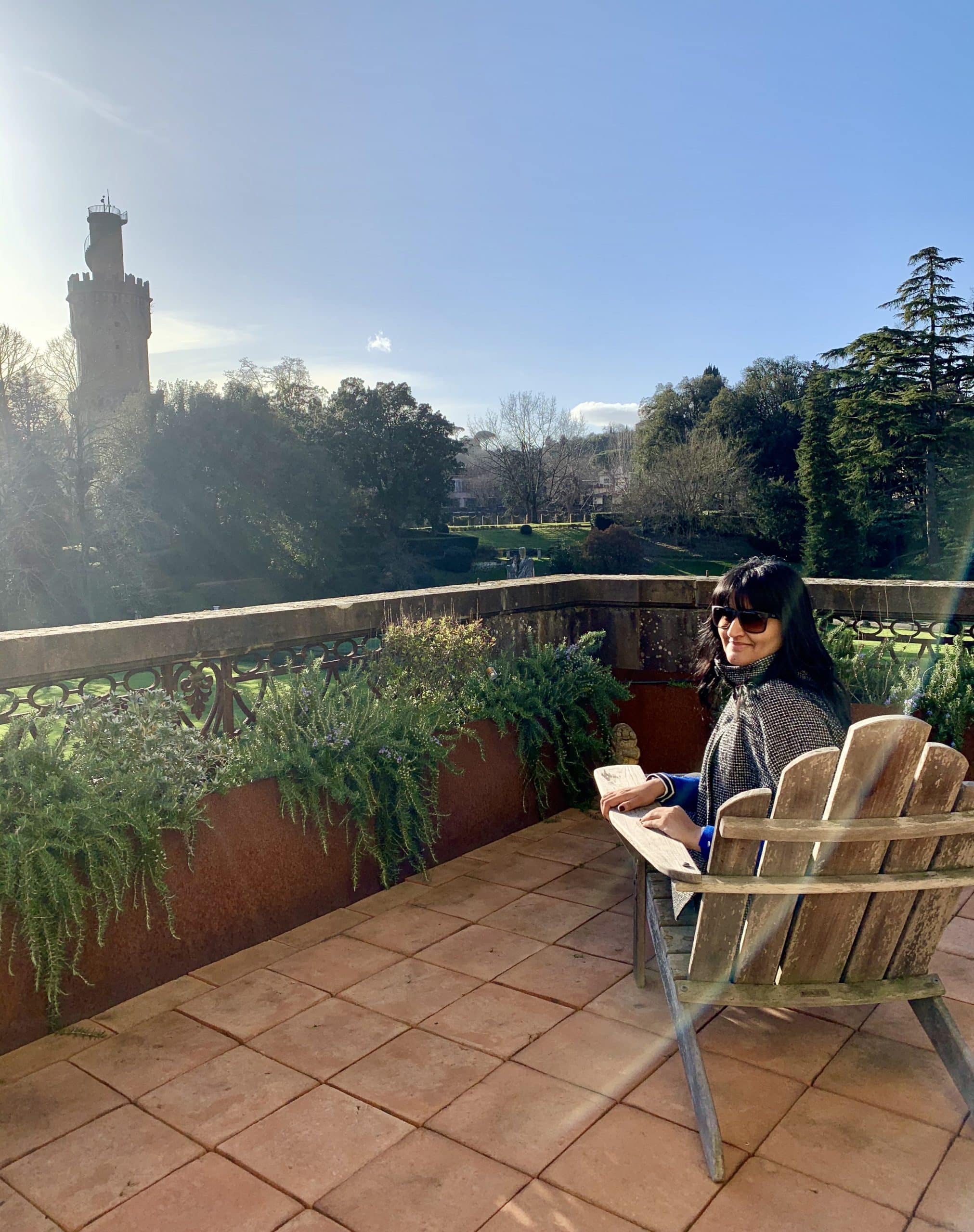 Bejal sitting on wrap around balcony with view of the Torrigianni tower