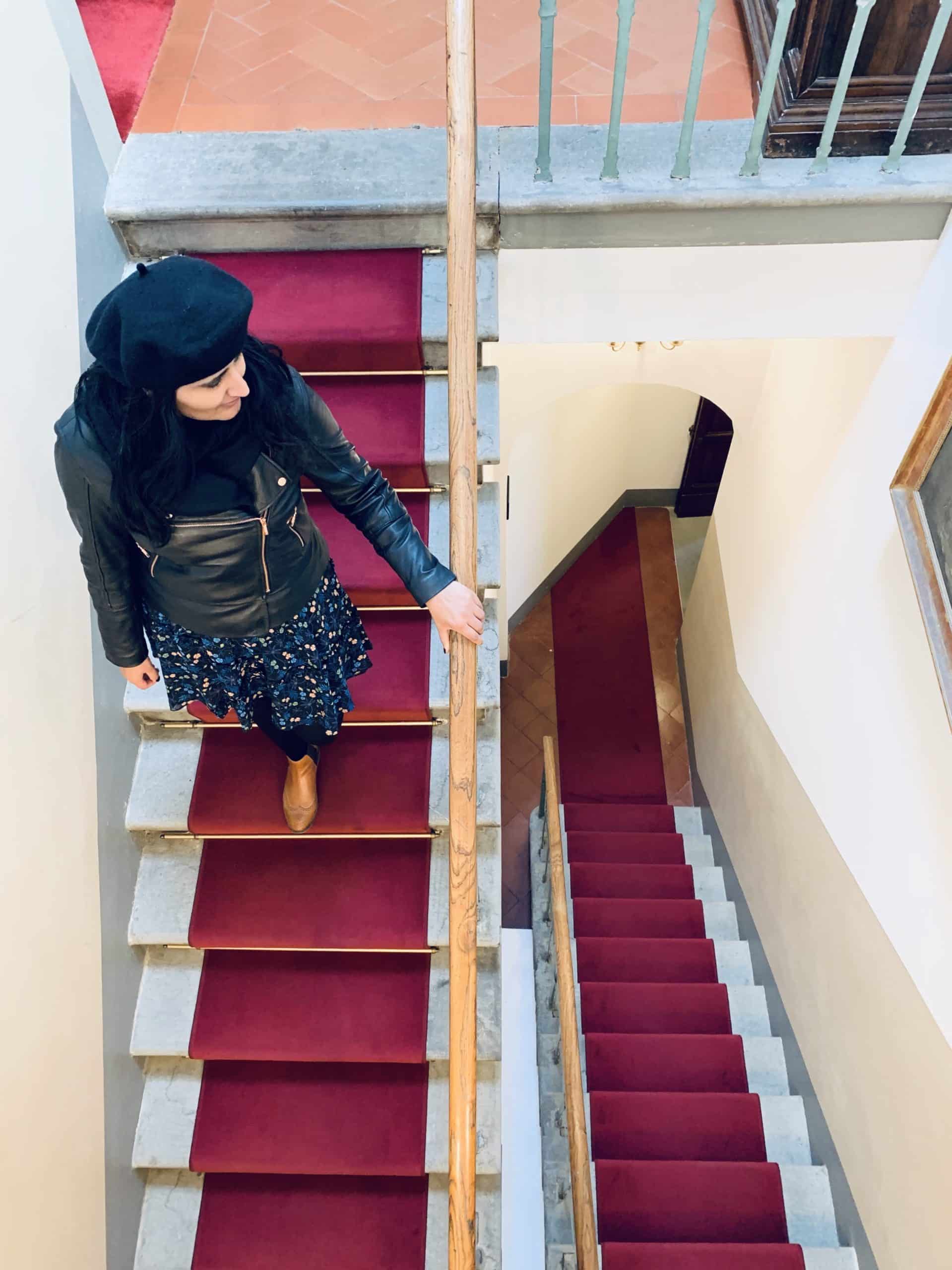 AdAstra Florence, bejal walking down stairs in entrance