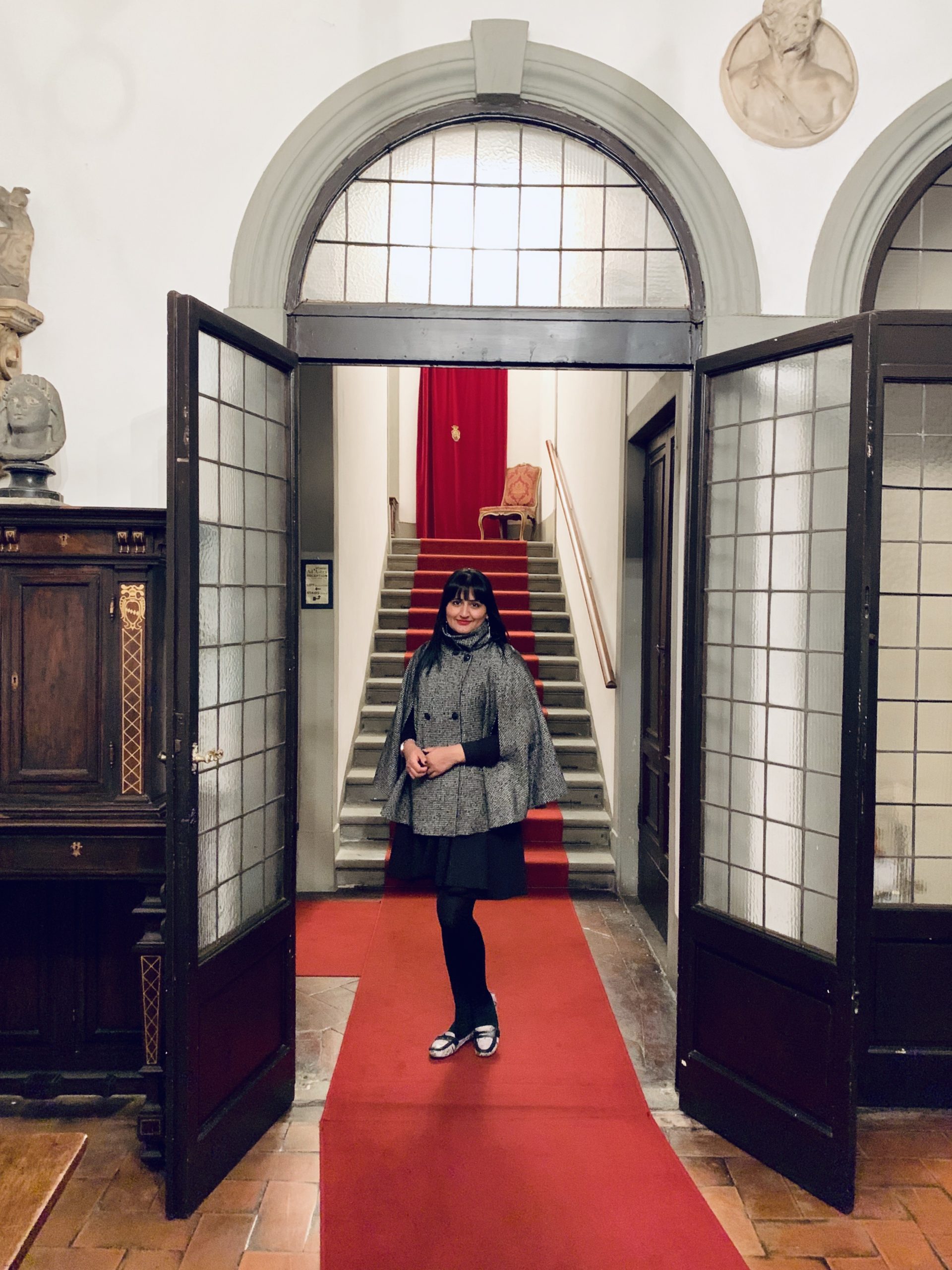 AdAstra Florence: Bejal standing at the bottom of the stairs in the entrance hallway