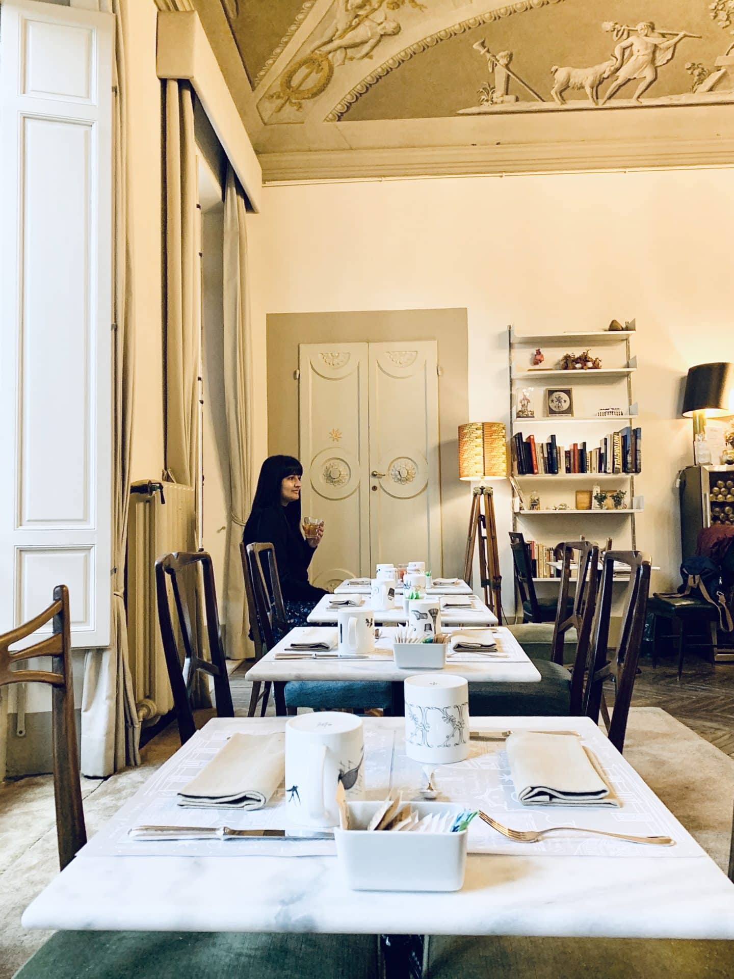 Bejal sipping on coffee at breakfast tables