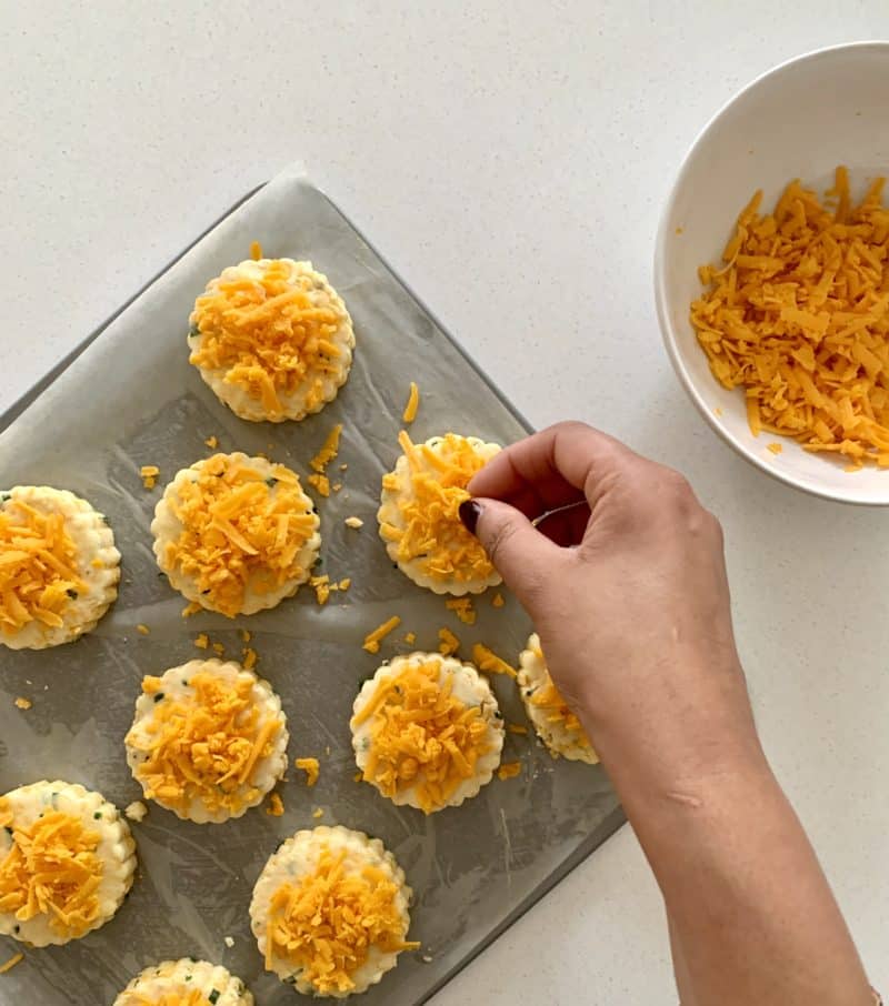 Scones being topped with Red Leicester cheese
