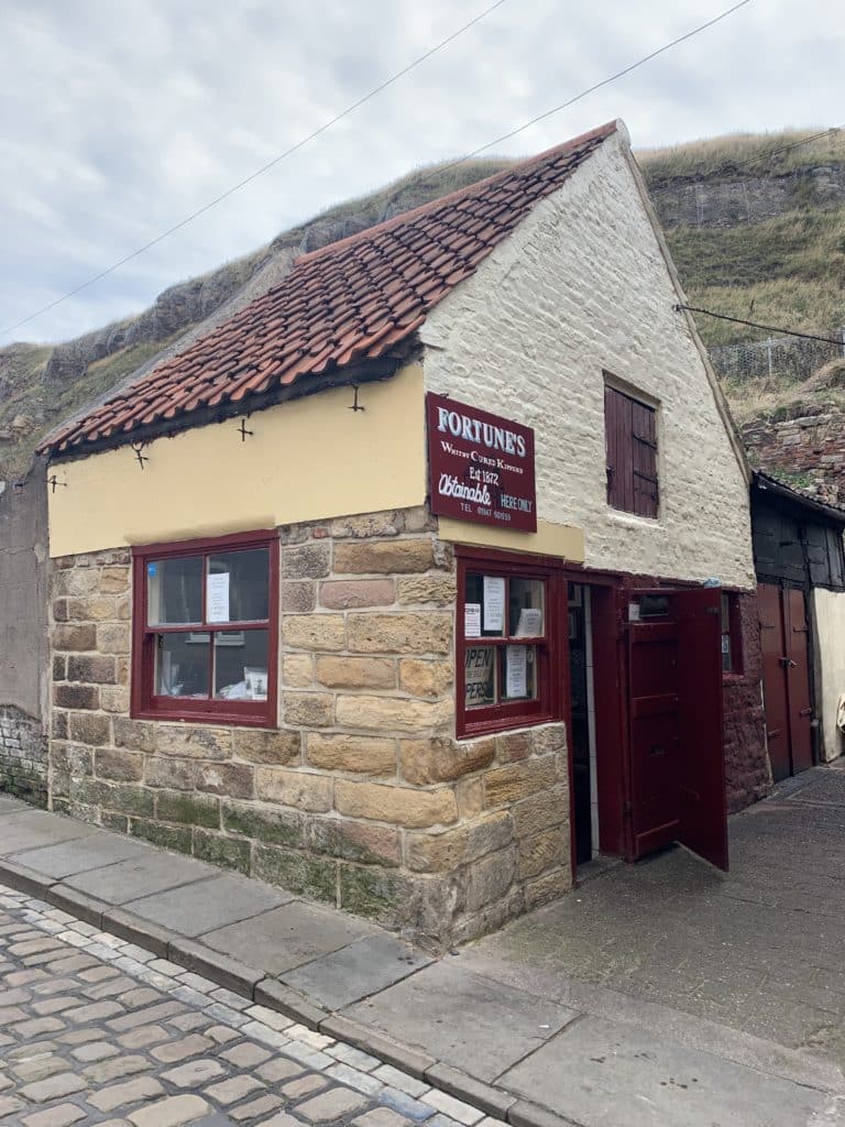 Fortunes Smokehouse in Whitby with its stone and maroon exterior