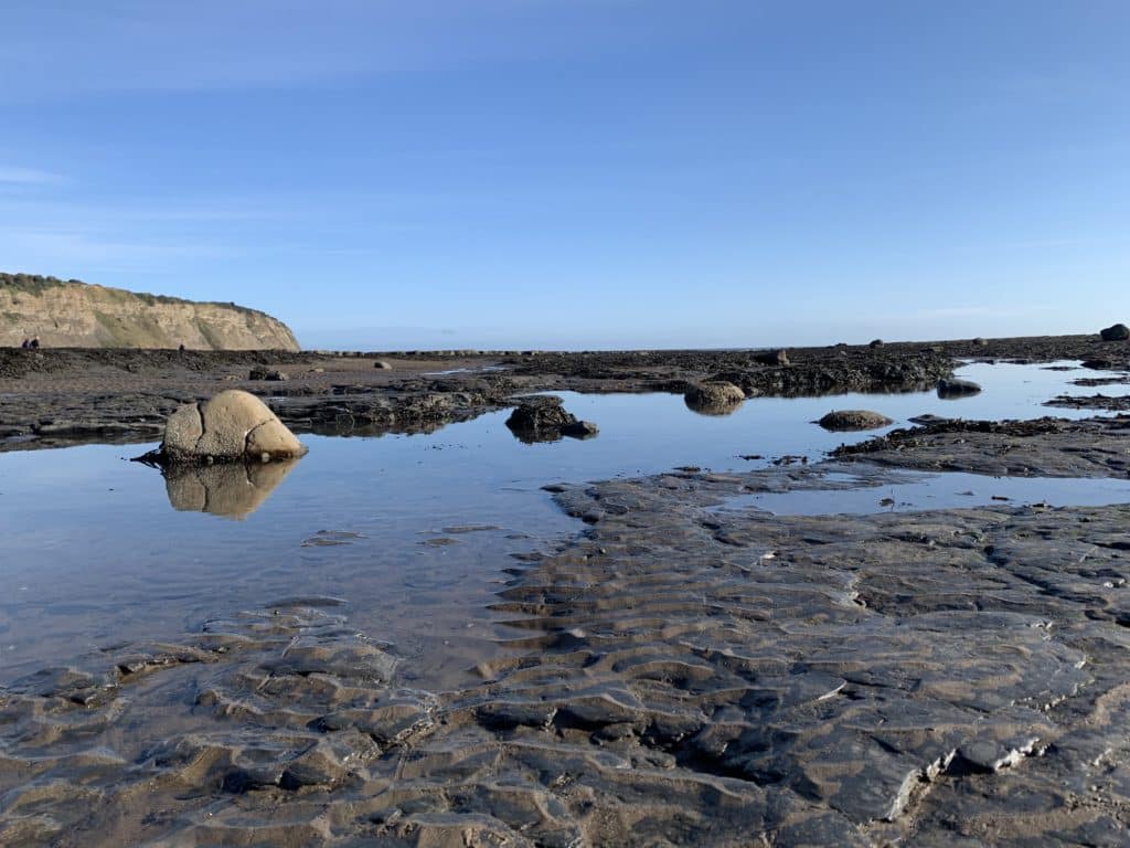Robin Hood's Bay rock pools and blue skies