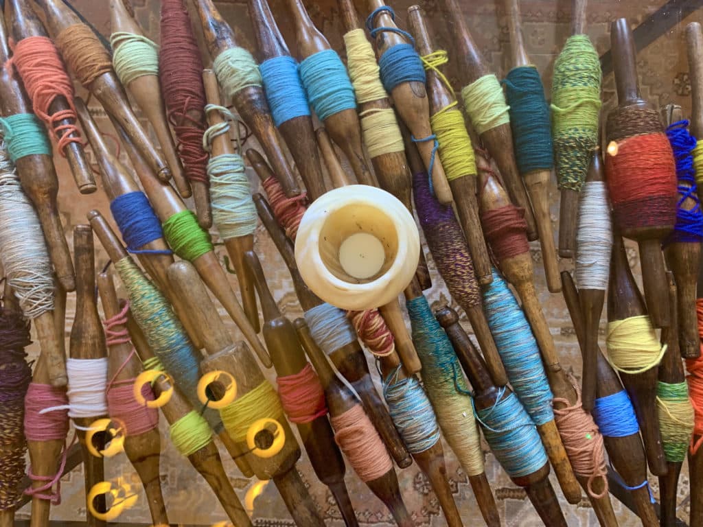 Bobbin filled glass table