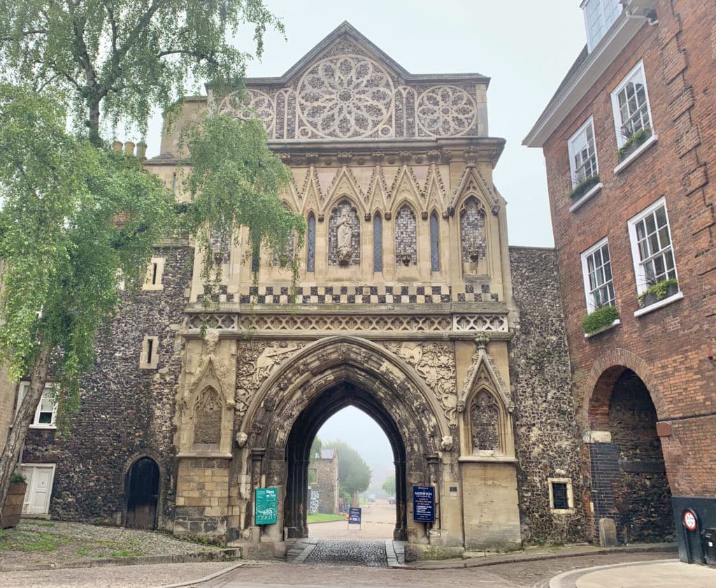 St Ethelbert Gate, Norwich with it's ornate design and trees peeping through from the left.A must see when seeing teh best of Norwich: thing sto do in 2 days.