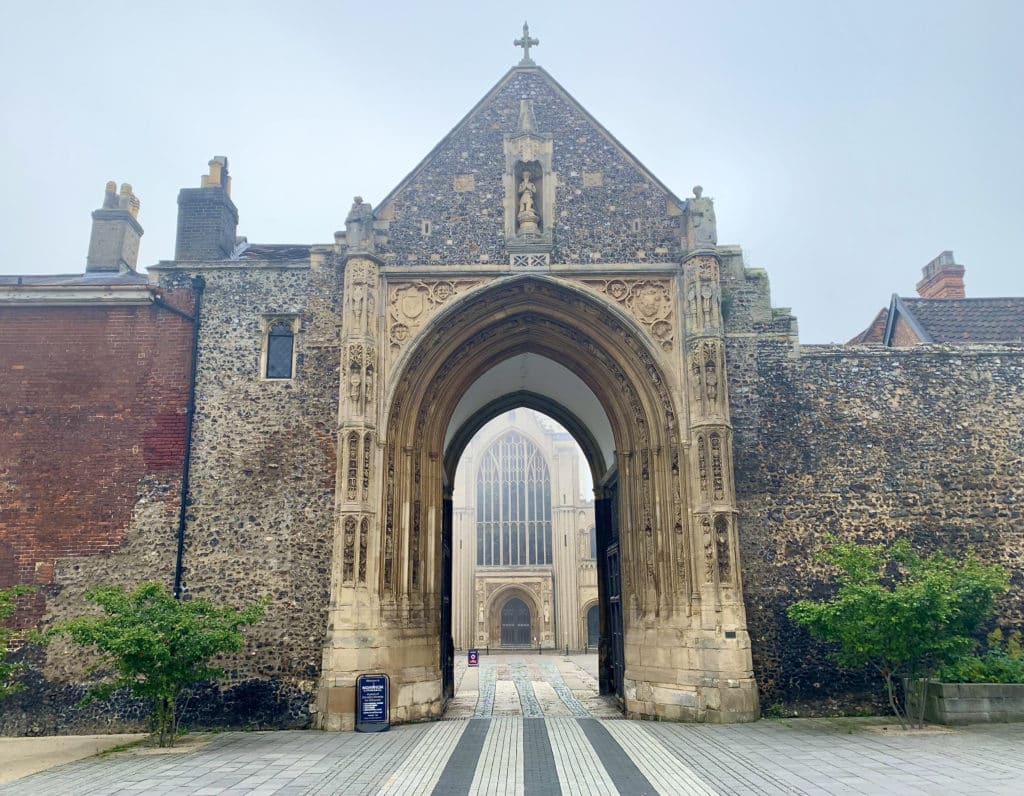 Thomas Erphingham Gate with the cathedral peeping through at the back and foggy skies