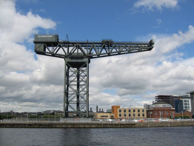 48 hours in Glasgow: The Finniestone Crane against the bright blue sky and red brick buildings