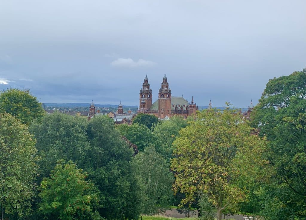 Kelvingrove Art Gallery in the distance with trees partially covering its facade