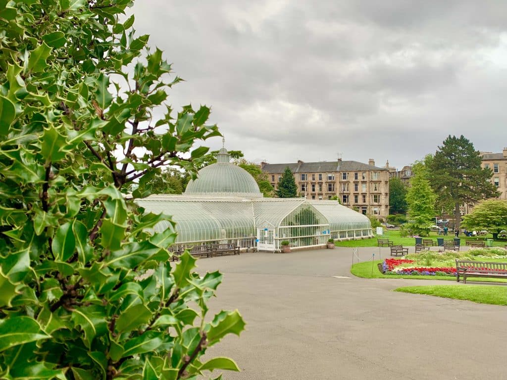 48 hours in Glasgow: Kibble Glass House at the Botanical Gardens in Glasgow exterior. Trees and shrub surround the conservatory