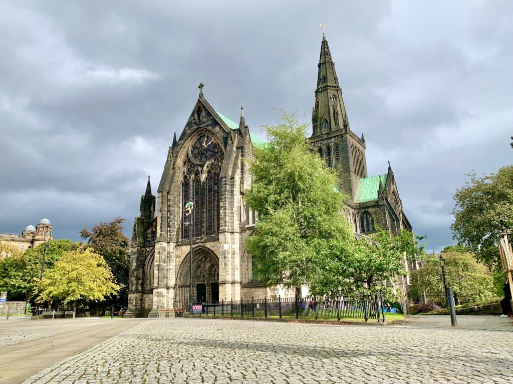 Glasgow Cathedral exteriors with trees at either side when spending 48 hours in Glasgow,