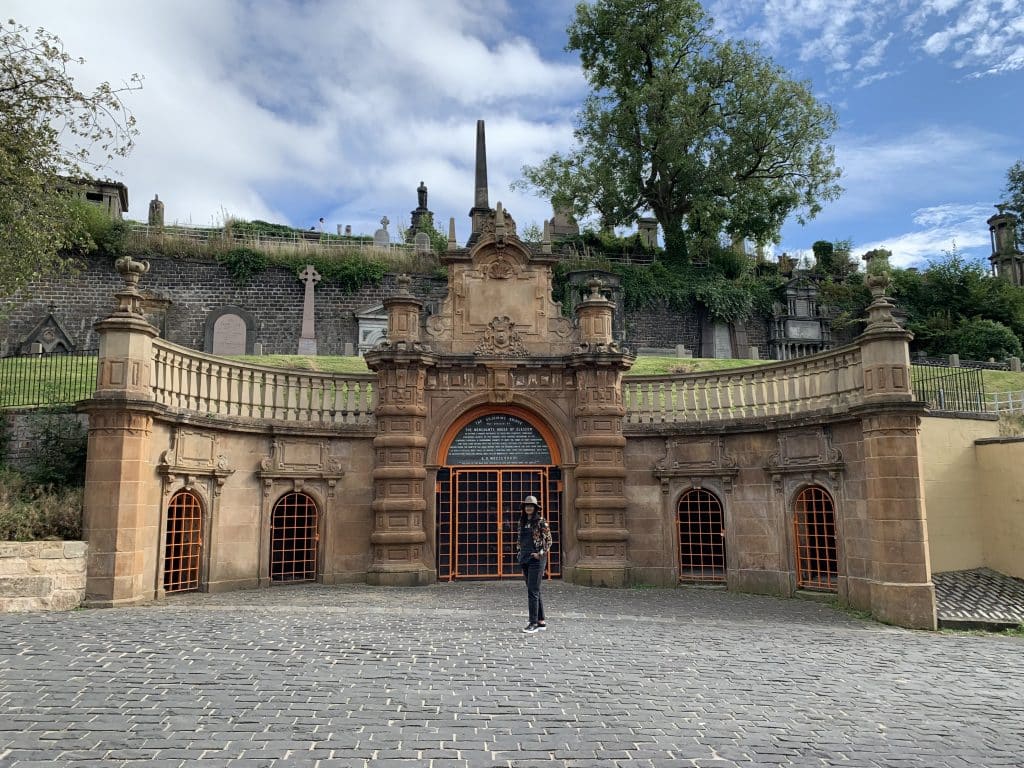 Bejal standing inside the grounds of the Glasgow Necropolis