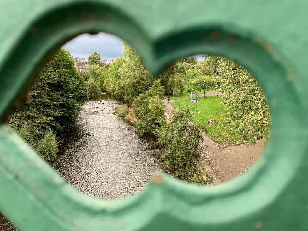 Glasgow Park in the West End through a bridge peek hole