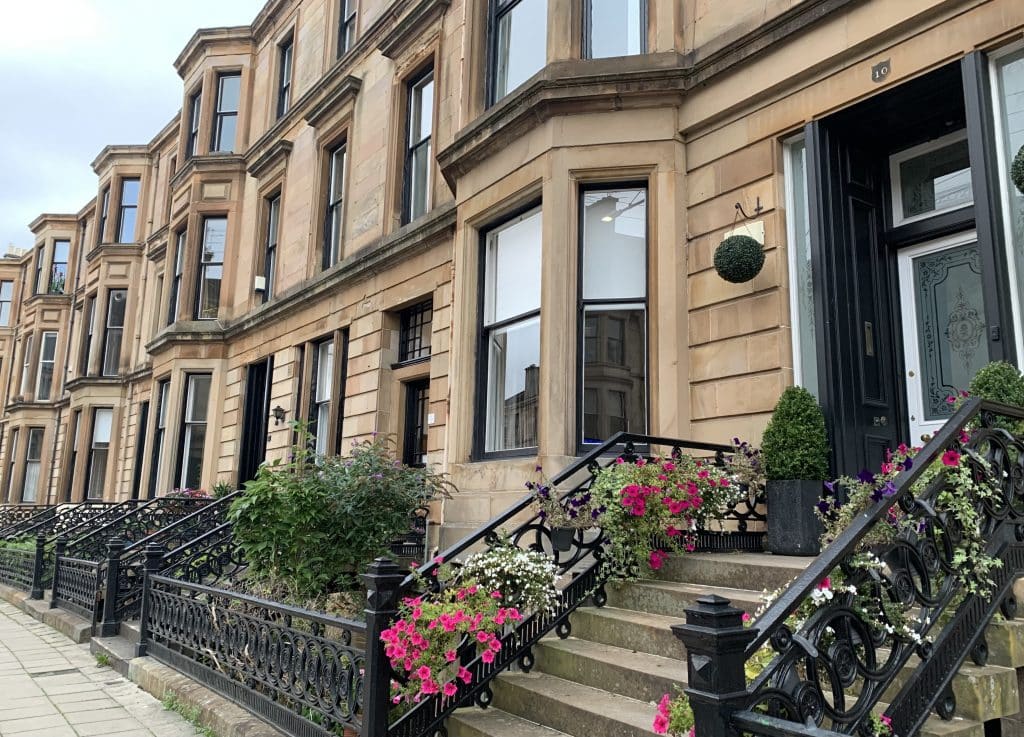 48 hours in Glasgow, Tenements in Glasgow on a pretty sreet with flower lined stairways.