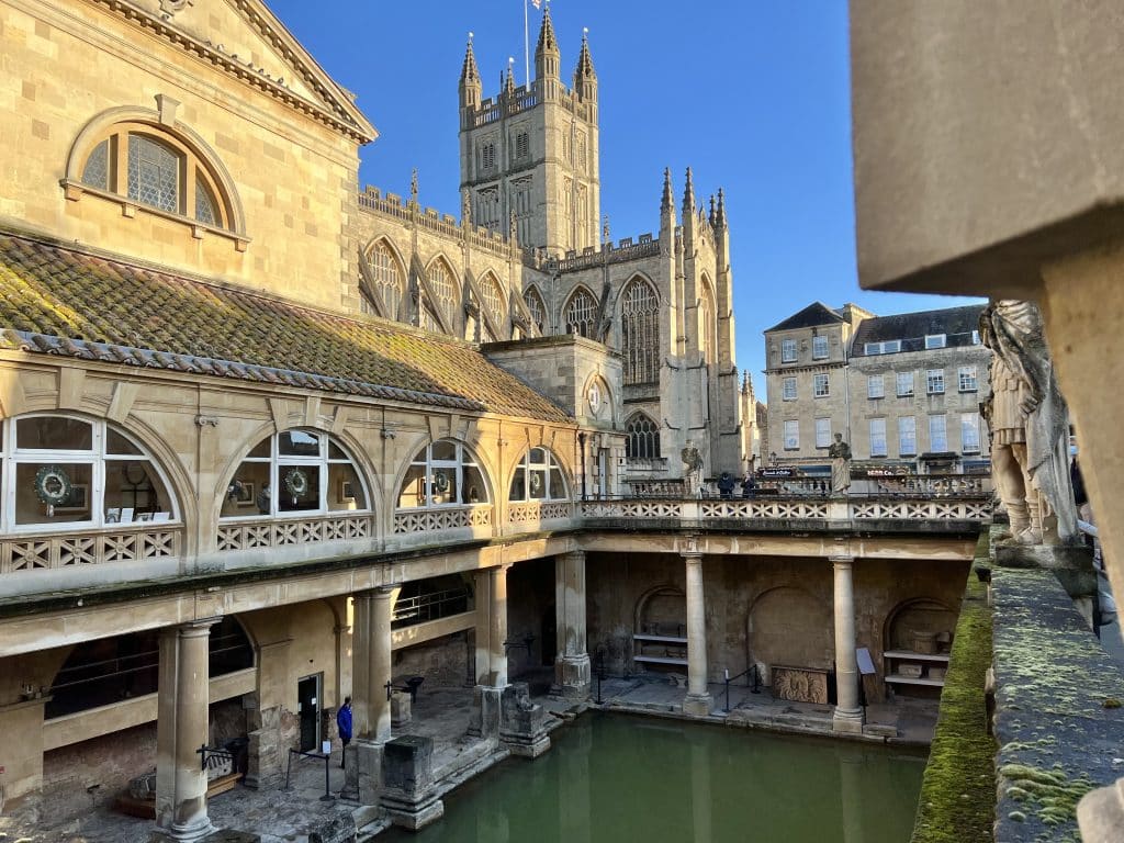 Roman Bath interior with views of Bath Abbey. The courtyard of the water in the cath is in the centre