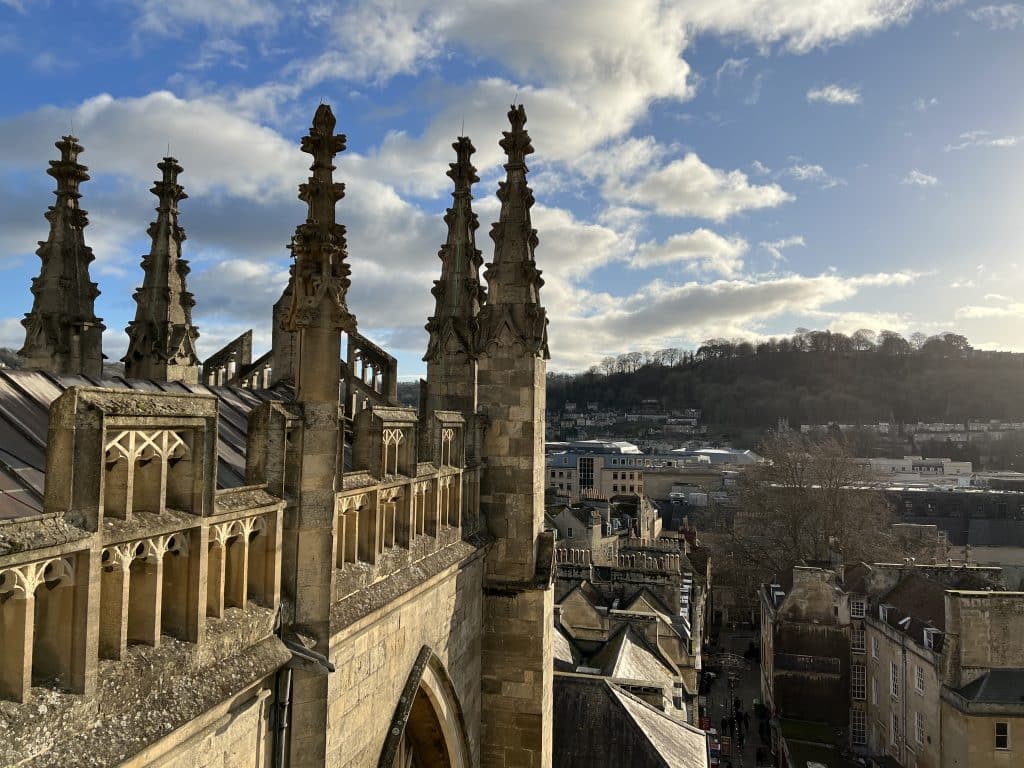 The rooftop tower of Bath Abbey with views over the other historical Bath city rooftops