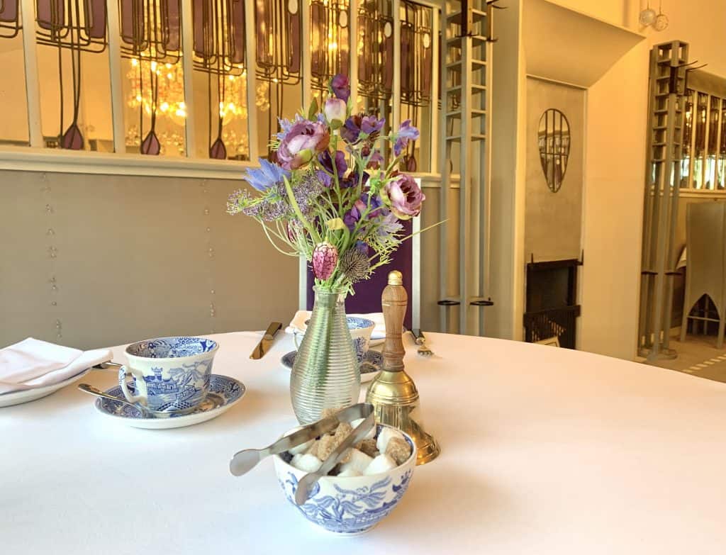 Vegetarian Food in Scotland: Mackintosh at The Willow tea table with a tea cup, floral centre piece and sugar cubes