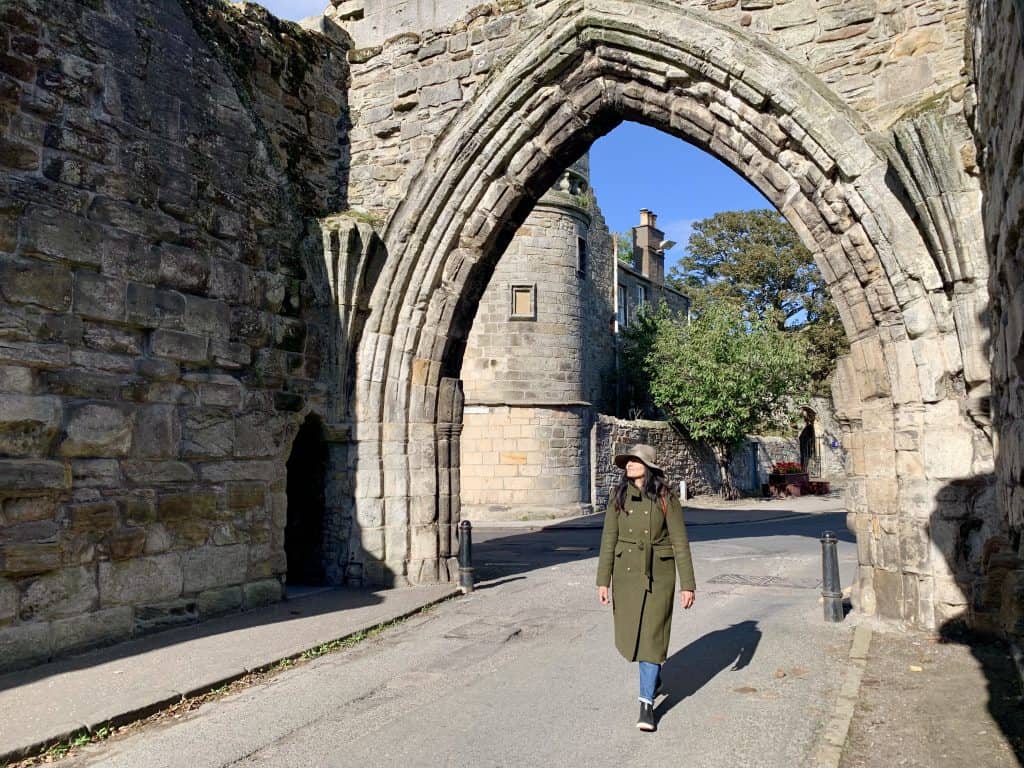 Villages and towns in Fife: St Andrews Walled archway with Bejal walking through