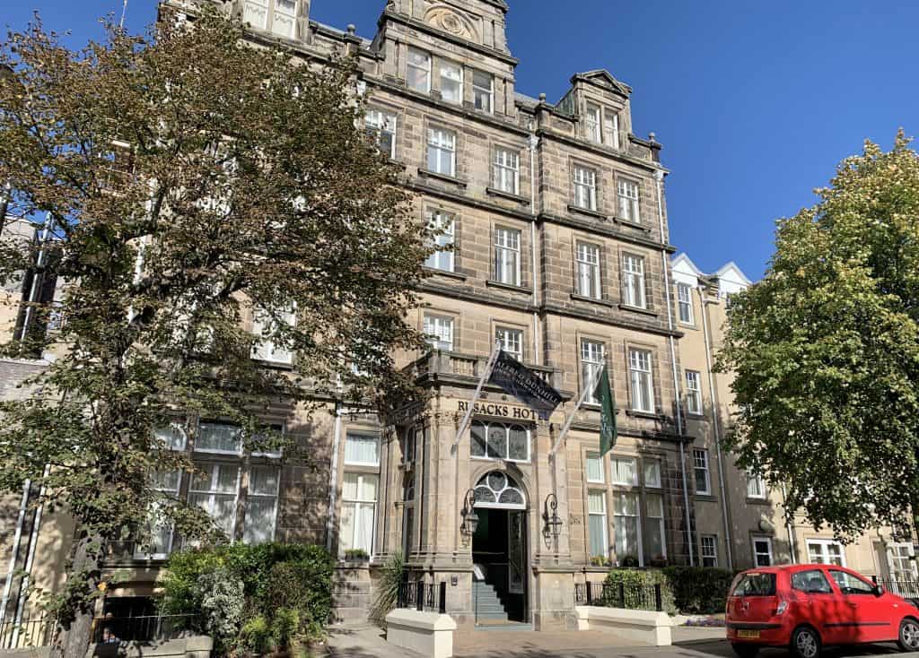 Rusacks Hotel, St Andrews exterior with a red car outside