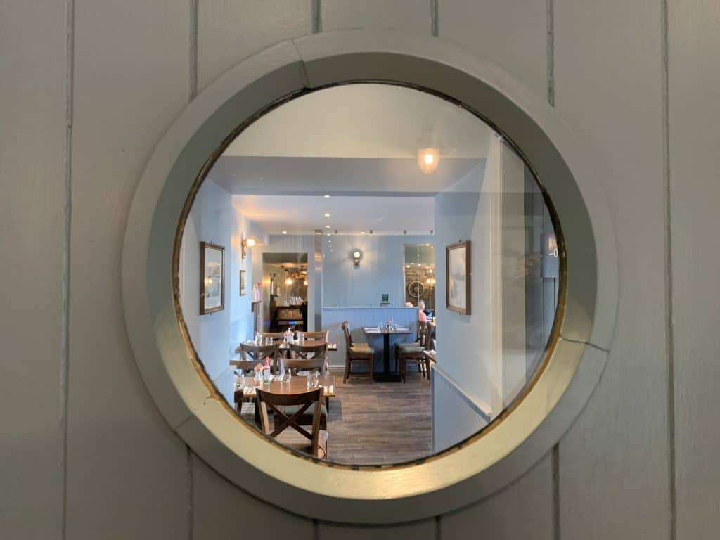 The Ship Inn Restaurant, Fife through a small circular window in teh restaurant.