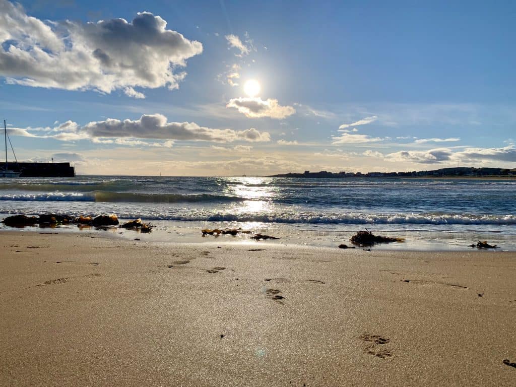 Villages and towns in Fife. Elie Sunset from the Ship Inn with the waves crashing and the golden sand