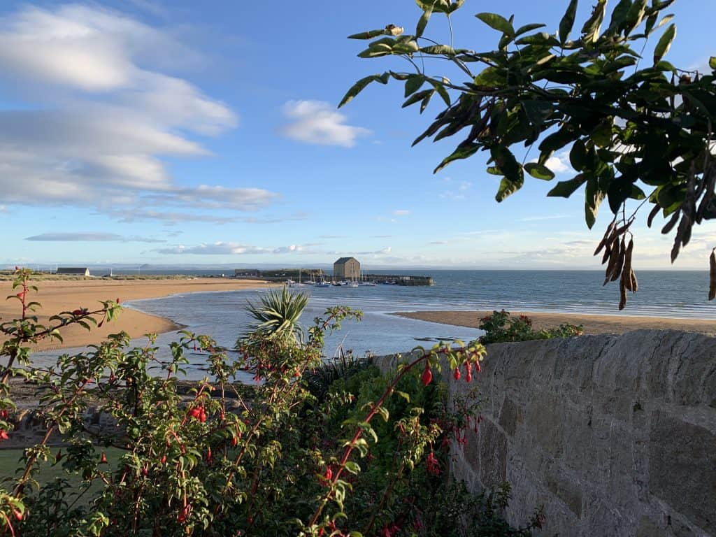Villages and towns in Fife:Elie sea front. Fife with flowers and the sea and harbour in the distance
