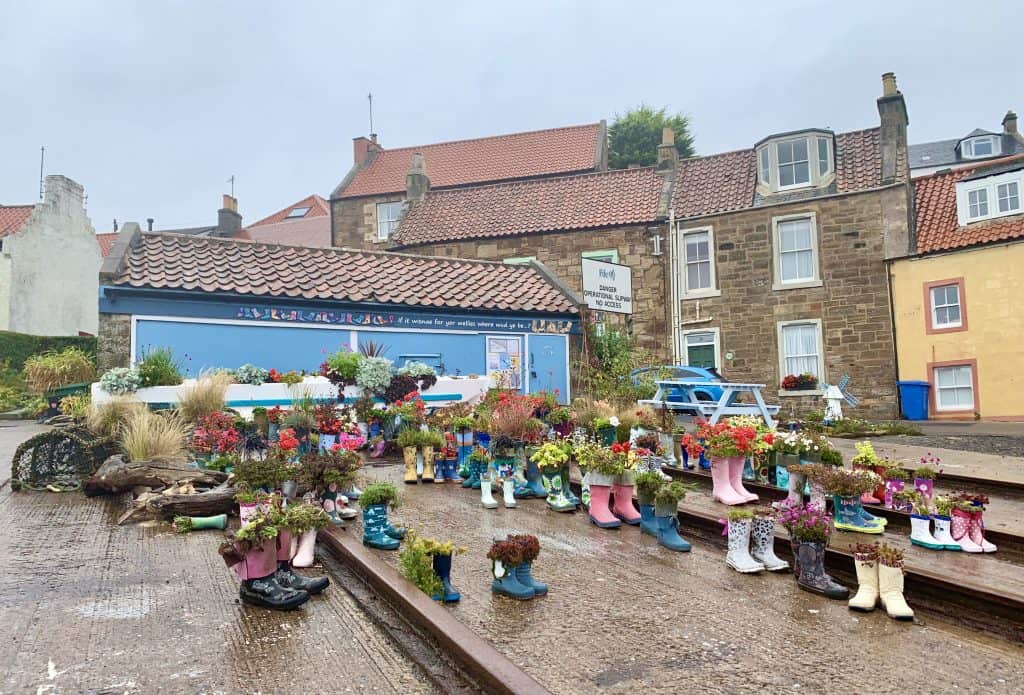 Villages and towns in Fife: St Monans Welly Garden, Fife. Welly's in different colours laid outside in a garden area