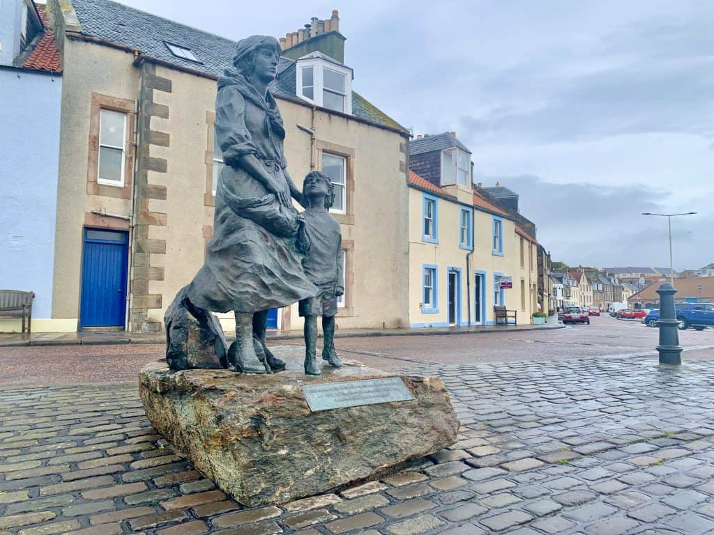 Villages and towns in Fife: Pittenweem Fishermen Memorial with shops in the background