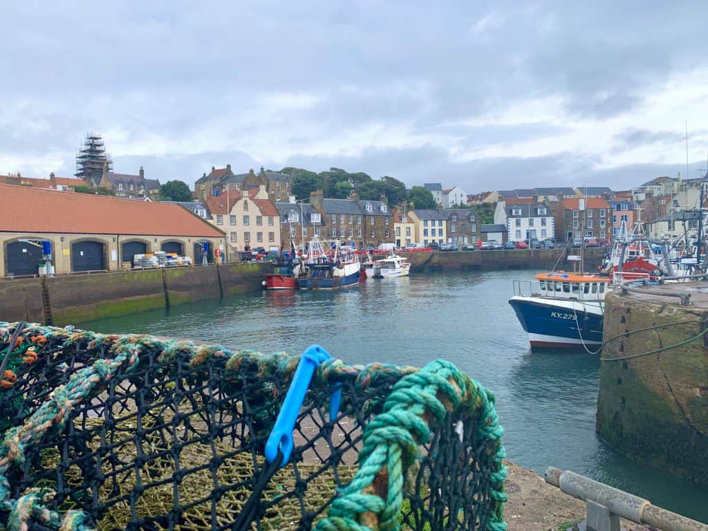 Villages and towns in Fife:Pittenweem, Fife harbour front with boats and shops in the distance