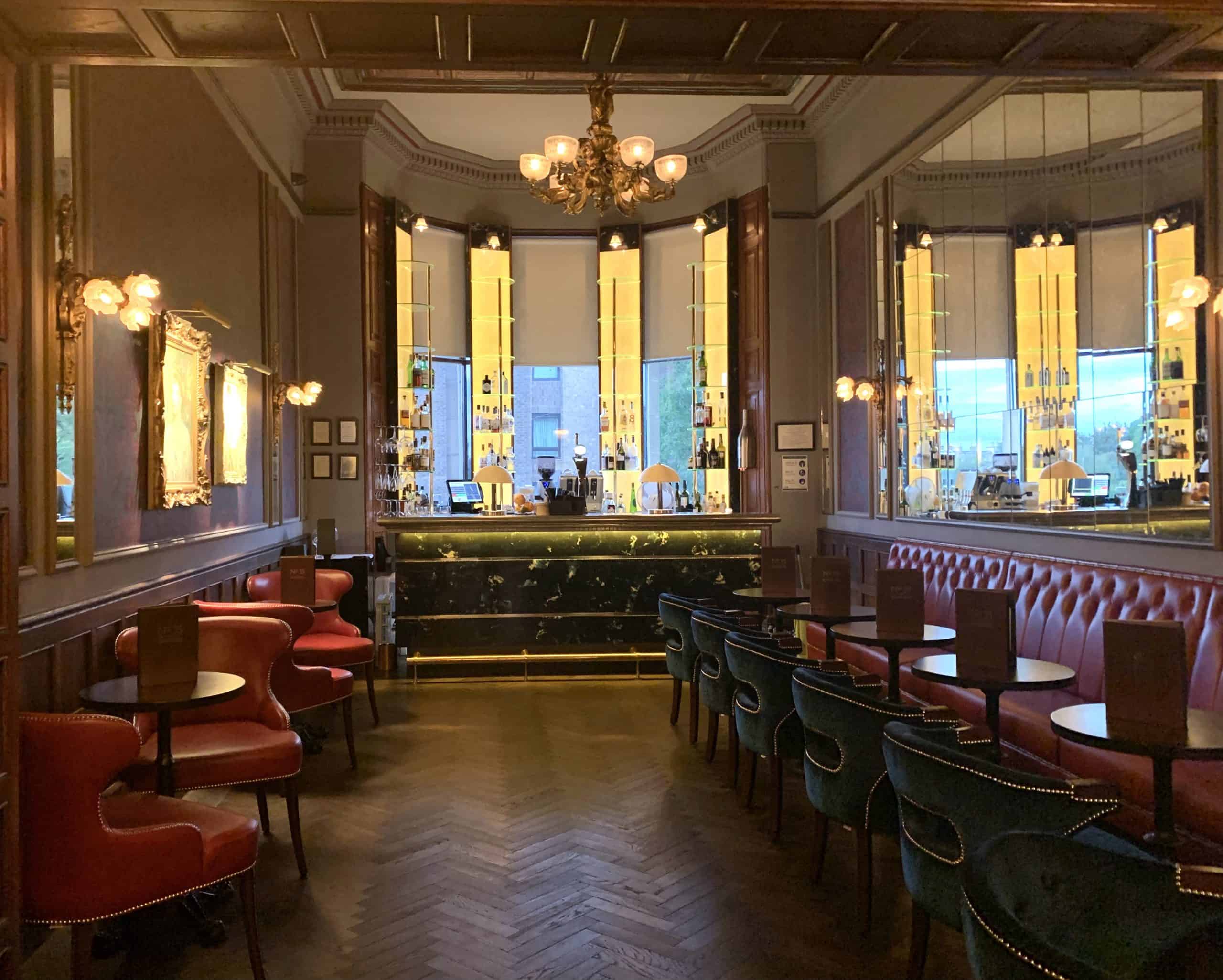 The Bonham Bar with red chairs and sofas down either side, Edinburgh