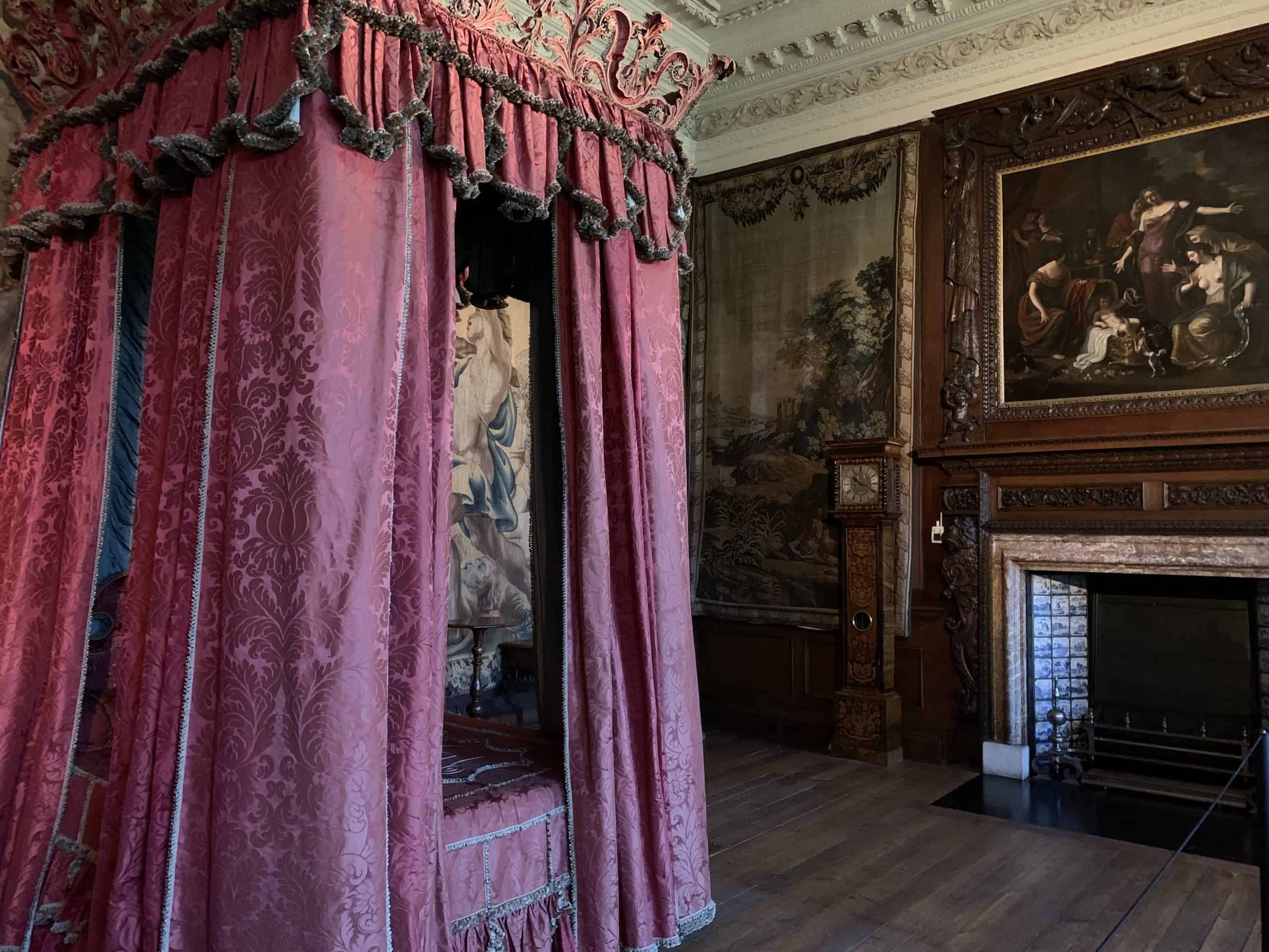 Holyrood House Palace, Edinburgh bedrooms with painting above the fireplace and a bed with pink drapes around it