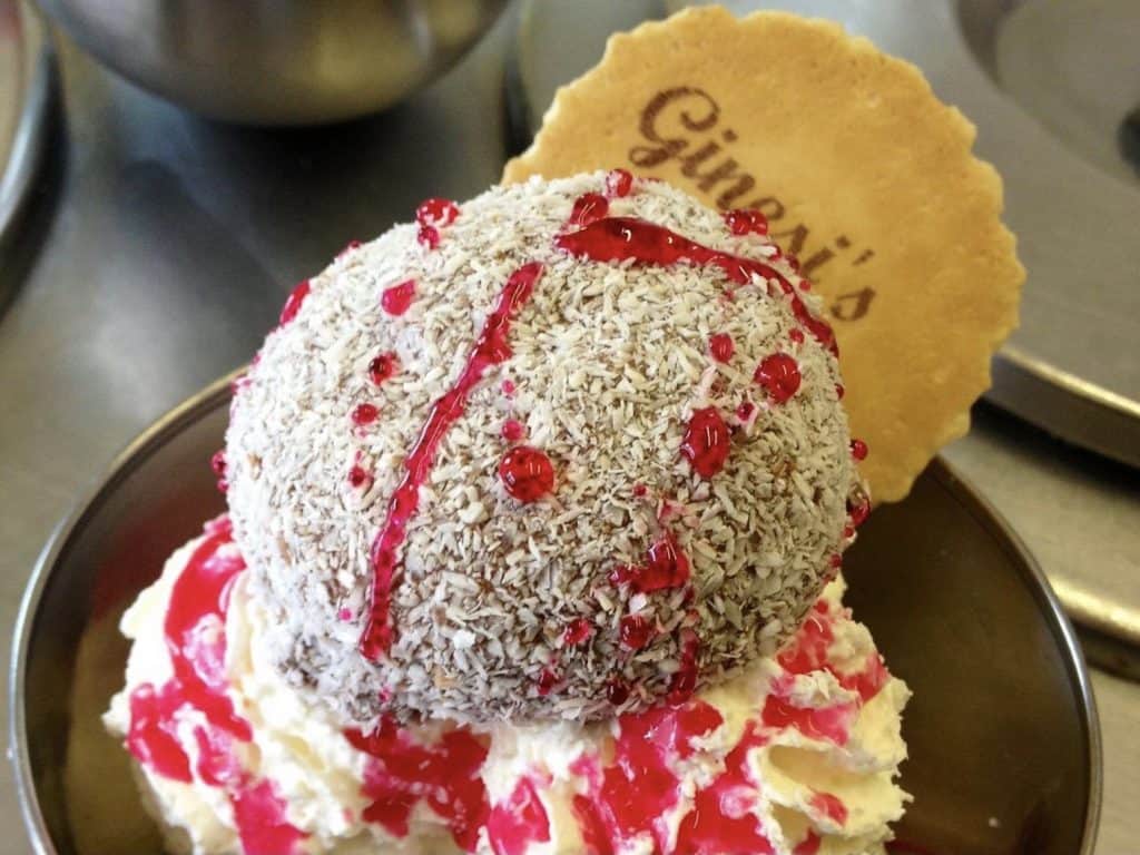 Ginesi's Ice-cream, Glasgow A scoop of ice-cream with a wafter and coconut shavings with raspberry sauce