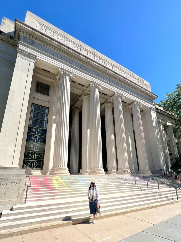 Bejal standing outside Main MIT building