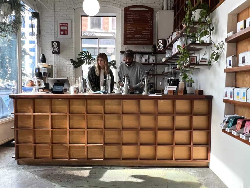 Gracenote Coffee coffee counter with staff making coffee