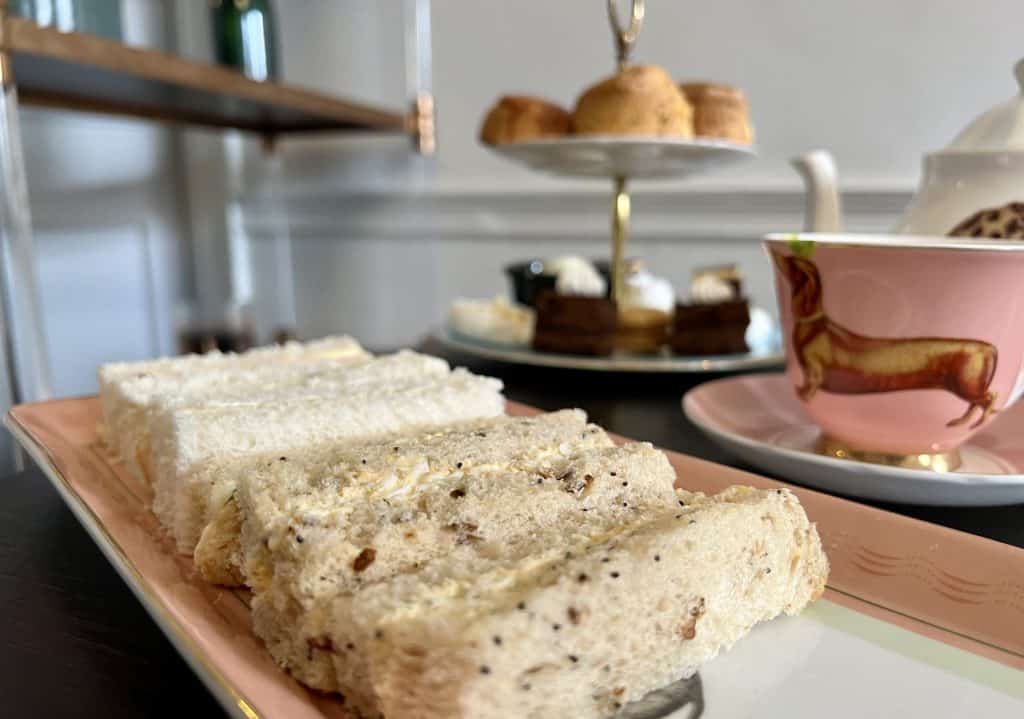Selection of sandwiches and cake stand