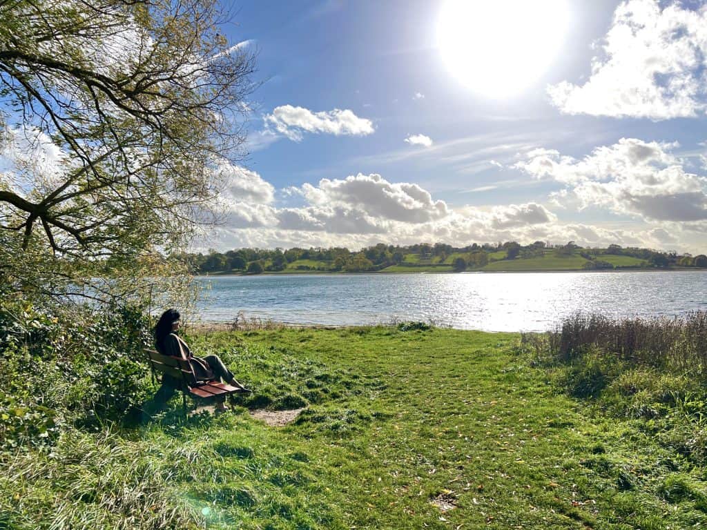Rutland Hall Hotel & Spa Bejal on bench looking at Rutland Water