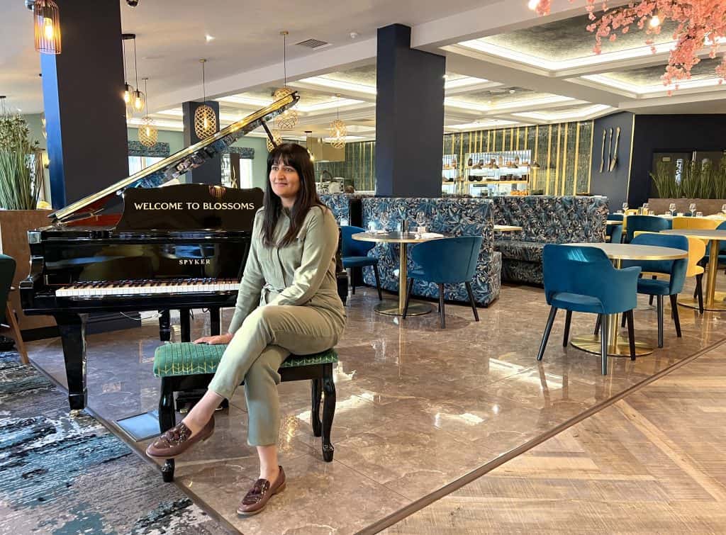 Blossoms Restaurant Piano with Bejal sitting on piano stool
