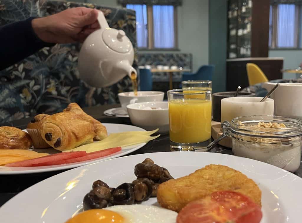 Blossoms Restaurant Breakfast food with tea pouring