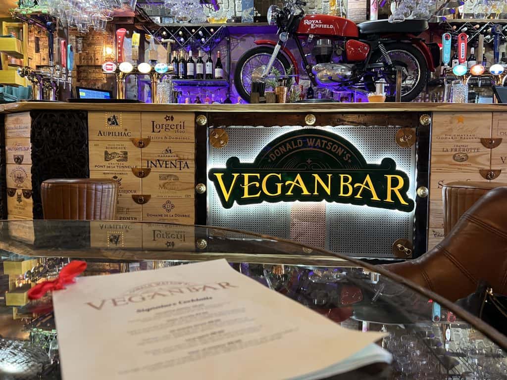 Vegan Bar menu with bar in background