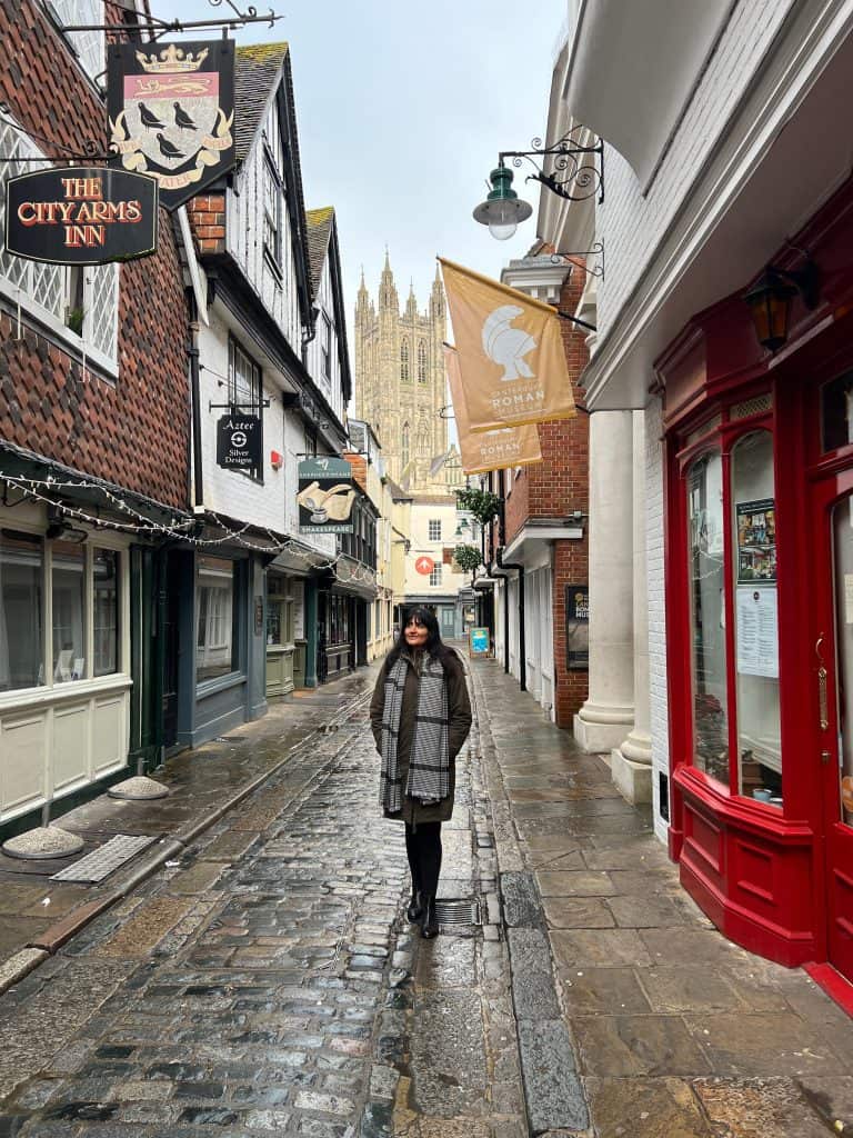 The best of Canterbury, Bejal in Canterbury alleyways with Cathedral in background and shops to the side