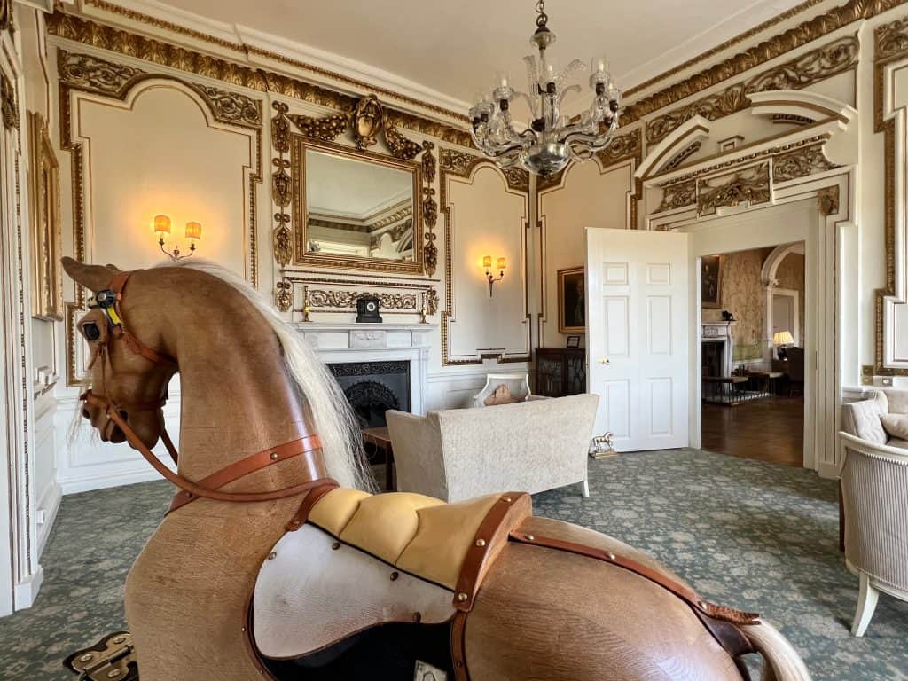 The Morning & Gilt Room with a wooden rocking horse