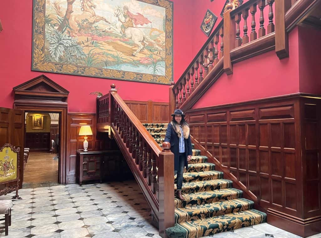 The grand staircase with bejal walking down